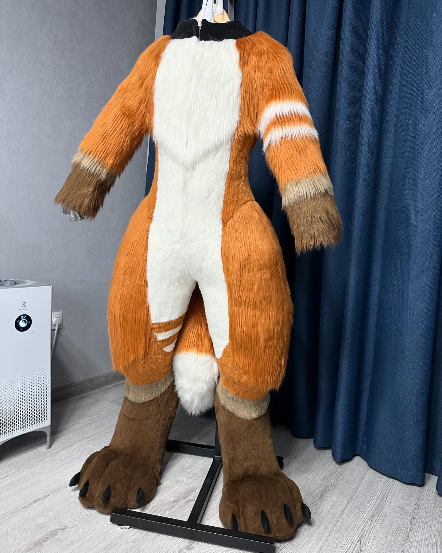 Ember — Red Panda full suit, back view