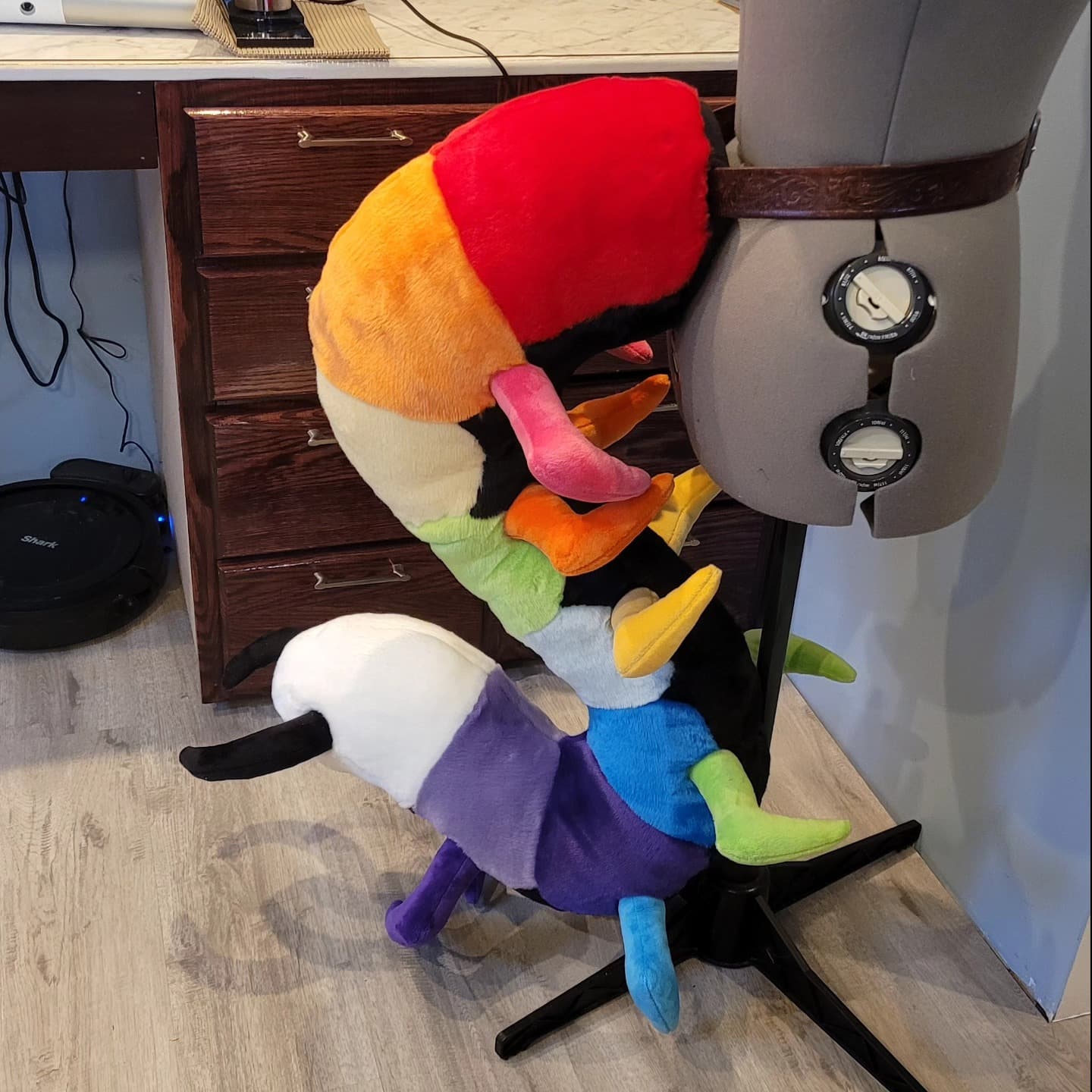 Prism Tail — Rainbow Caterpillar tail, full view on stand