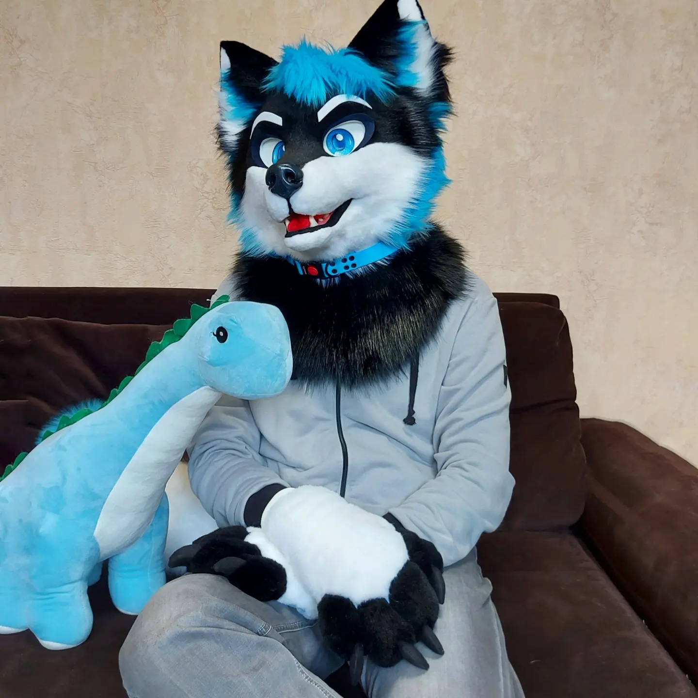 Diego — the maker's own black-and-blue husky fursona, made in-house