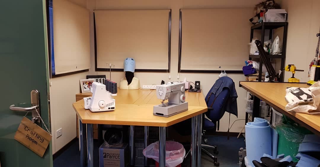 The crafting room — sewing machines ready on the workbench