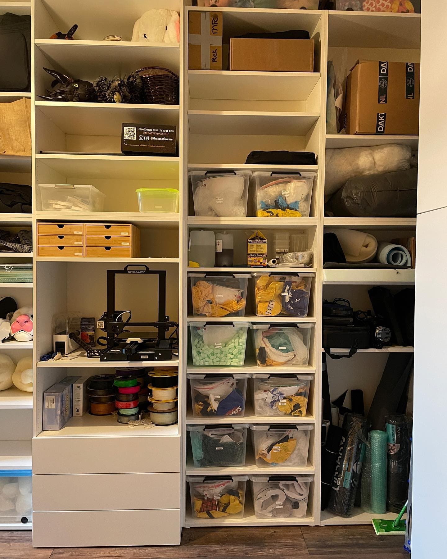 Materials wall — labelled bins of fur, foam, and filament